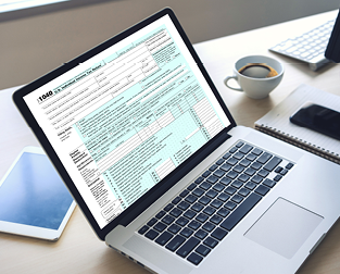 A laptop with a tax form on the screen