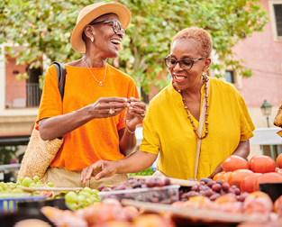 Two women shopping at a farmer’s market