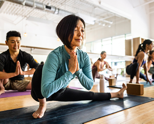 A group of people at a yoga class