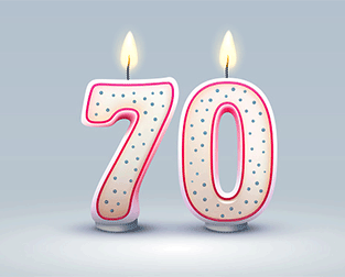Lit candles spelling out seventy
