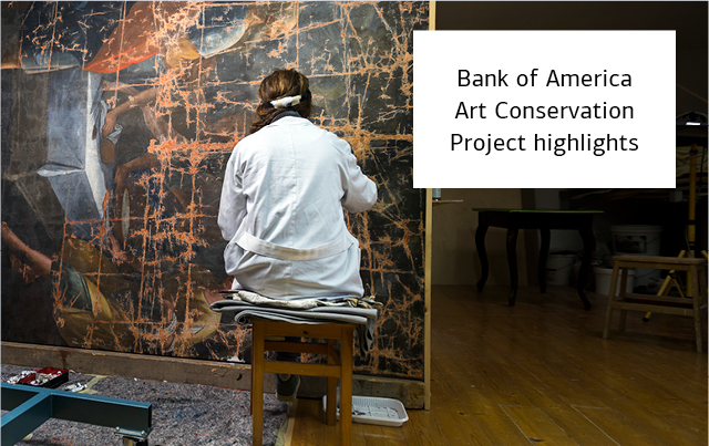 Conservation worker tending to a large artwork